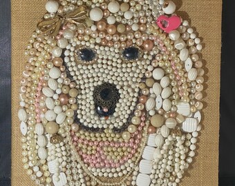 Adorable poodle dog created with vintage costume jewelry on a burlap canvas wall hanging.