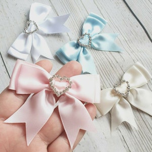 Satin Ribbon Bow with Heart Diamante Buckle. Pink, Blue, White or Ivory
