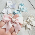 Satin Ribbon Bow with Heart Diamante Buckle. Pink, Blue, White or Ivory