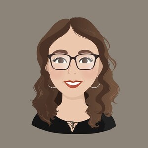 May include: A woman with brown wavy hair wearing black framed glasses and a black top with a lace detail at the neckline. She is smiling.