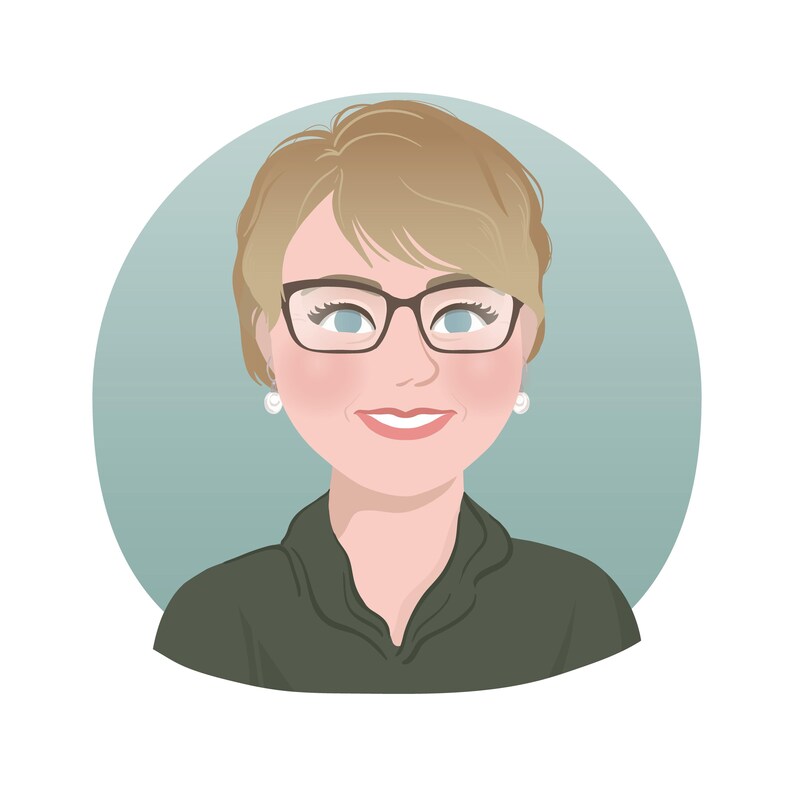 May include: A woman with short blonde hair wearing glasses and a dark green shirt. She is smiling and looking directly at the camera.