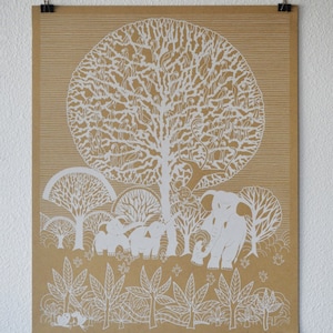 May include: A brown paper print with a white design of a large tree with many animals in it. There are elephants, birds, and monkeys in the tree. There are smaller trees and bushes around the large tree. The print has the text "Laura Park 2014" in the bottom right corner.