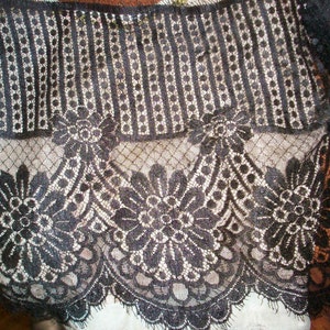 1920s or 30s black 0r cream lace with lovely floral/deco design