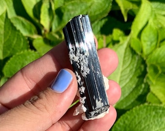 Raw black tourmaline specimen gem quality on feldspar from Brazil