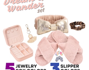 May include: A set of accessories including a pink jewelry box, a gold bow headband with "OMG!" text, a brown scrunchie, a keychain, and pink slippers. The text "The Dream & Wander set" is at the top. The image also shows "5 JEWELRY BOX COLORS" and "3 SLIPPER COLORS".