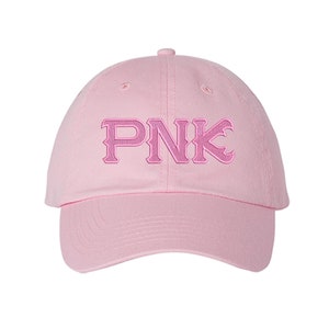 May include: Pink baseball cap with the word "PNK" embroidered in a darker pink on the front.