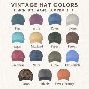May include: A collection of fifteen pigment-dyed, washed, low-profile baseball hats displayed in a grid. The colors include teal, wine, royal blue, stone, aqua, mustard, forest green, brown, cardinal, navy, olive, periwinkle, camo, black, and texas orange.
