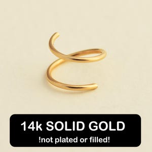 May include: A gold double helix hoop earring made of 14k solid gold. The earring is not plated or filled. 14k SOLID GOLD !not plated or filled!