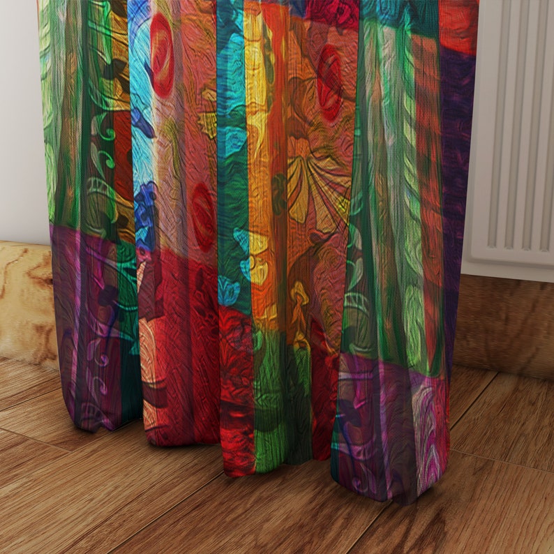 May include: A colorful curtain with a patchwork design featuring various shades of red, orange, yellow, green, blue, and purple. The curtain is made of a sheer fabric and has a flowing, relaxed look.