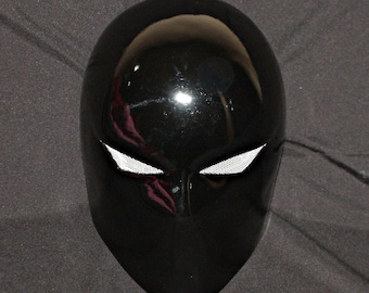 May include: A glossy black full-face mask with white mesh eye openings. The mask has a smooth, reflective surface and a streamlined design. The Etsy shop name "Customhelmet2014" is visible at the bottom.