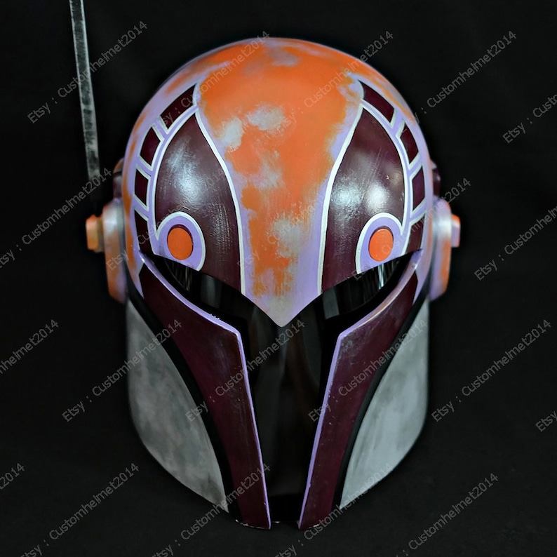 May include: A purple, orange, and white helmet with a visor. The helmet has a weathered look with a distressed paint finish.