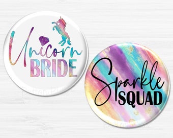 May include: Two round buttons with colorful watercolor backgrounds. One button says "Unicorn Bride" with a unicorn silhouette. The other button says "Sparkle Squad".