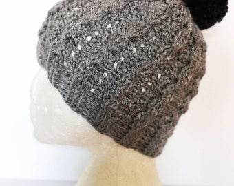 Almond cables crochet hat with pompom