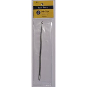 May include: A silver crochet hook in a clear plastic package with a yellow label that says "John James" and "Latch Hook".