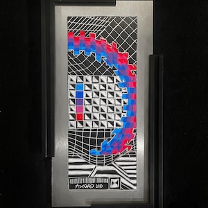 May include: Abstract art piece in a black frame with a silver border. The artwork features a black and white grid design with a pixelated, curved shape in red and blue. The text "AXORO LTD" is visible.