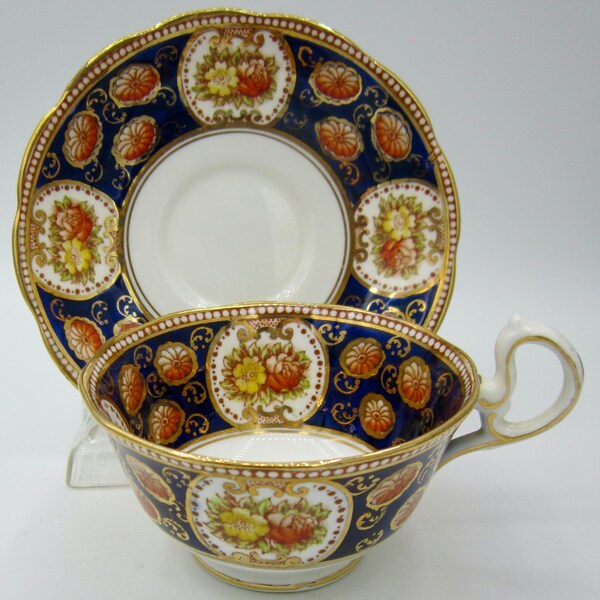 Royal Albert Crown China Teacup and Saucer (6471) Orange and Yellow Flowers on Cobalt Blue Background - England