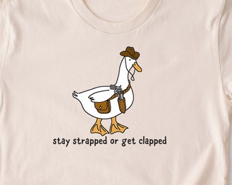 Stay Strapped or Get Clapped Shirt. Cowboy Goose T-shirt. Funny Cute T-shirt Gift Idea. Wild West Tshirt Animal Country Western Lover T.