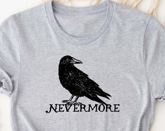 May include: A gray t-shirt with a black crow illustration and the text "Nevermore" printed on the front.