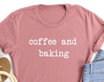 May include: A mauve t-shirt with the text "coffee and baking" in white.