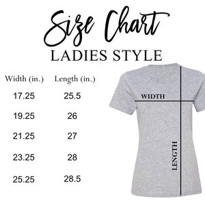 May include: A grey Ladies Style t-shirt with a size chart. The chart lists sizes S to 2XL, with widths ranging from 43.8 cm to 64.1 cm and lengths from 64.8 cm to 72.4 cm.