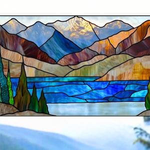 May include: A set of three ceramic canisters with lids. The canisters are white with a blue floral pattern. The largest canister is 8 inches tall, the medium is 6 inches, and the smallest is 4 inches.