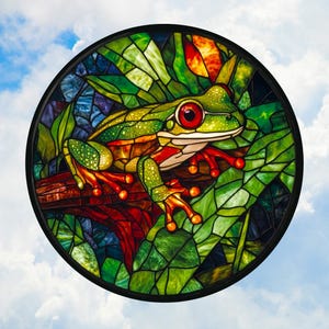 May include: A stained glass window depicting a green tree frog perched on a branch with red and orange leaves. The frog has red eyes and a green body with orange and brown markings.