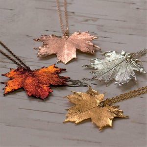 Canadian maple leaf necklaces in four colours, silver, gold, rose gold or irridescent, made from real maple leaves. Gift boxed.