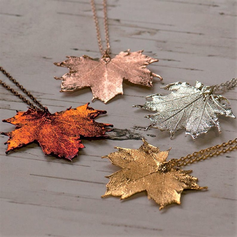 Canadian maple leaf necklaces in four colours, silver, gold, rose gold or irridescent, made from real maple leaves. Gift boxed.