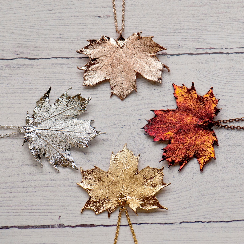 Canadian maple leaf necklaces in four colours, silver, gold, rose gold or irridescent, made from real maple leaves. Gift boxed.