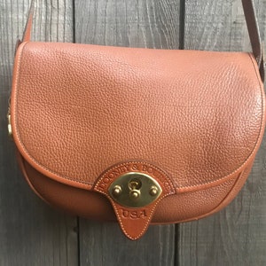 Genuine Dooney & Bourke All Weather Leather Cross Body Bag
