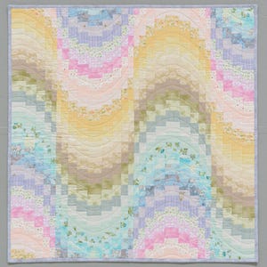 May include: A colorful quilt with a wavy pattern in shades of blue, green, pink, and yellow. The quilt is made of patchwork fabric squares and is quilted with a wavy design.