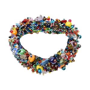 May include: A colorful beaded bracelet with a variety of stones and beads, including clear, blue, green, red, orange, and yellow.