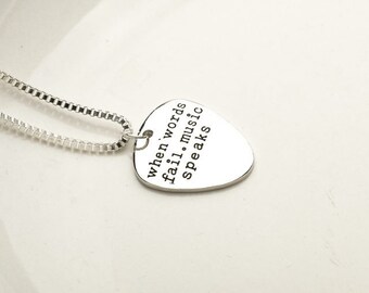 Guitar Pick Necklace Stamped with "When words fail, music speaks"