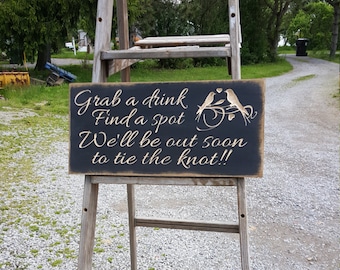 Custom Carved Wooden Sign - "Grab a Drink, Find a Spot, We'll Be Out Soon To Tie The Knot"