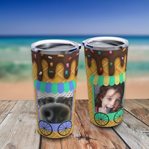 May include: Two stainless steel tumblers with a summer ice cream cone design. The tumblers have a brown chocolate drizzle, colorful sprinkles, and a waffle cone pattern. One tumbler has a photo of a dog's face in the ice cream window, and the other tumbler has a photo of a child sticking their tongue out in the ice cream window.