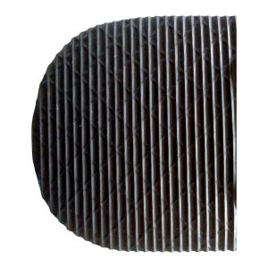 May include: Close-up of a black rubber sole with a textured pattern of raised lines and diamonds.