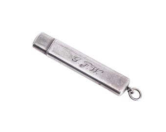 May include: A silver match safe with a hinged lid and a small ring on the end. The match safe is engraved with the initials "G.F.W."
