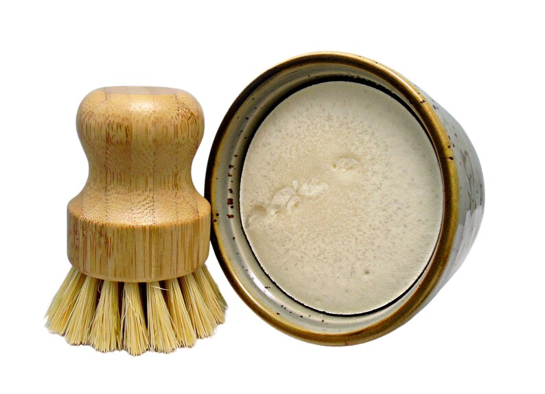 Dish washing brush and solid soap in ceramic ramekin