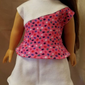Pink with multicolored star top white skort.