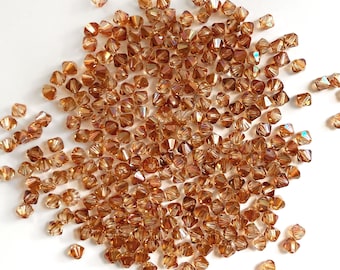 40x Perles de cuivre en cristal Swarovski, 4mm Swarovski Toupies 5301, Perles de cristal Toupie marron