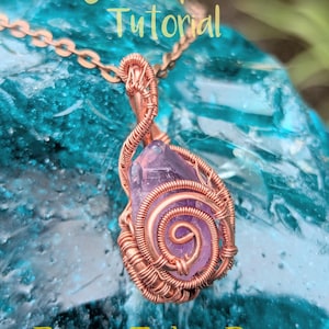 May include: A handcrafted copper wire-wrapped pendant with a purple crystal. The pendant is suspended from a delicate chain. The text "Heady Wrap Pendant Tutorial" and "From Tobe Rose" are visible.