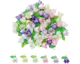 May include: A collection of pastel-colored flower charms with green leaves. The charms are made of plastic and have a glossy finish. They are perfect for adding a touch of whimsy to jewelry, crafts, and other projects.