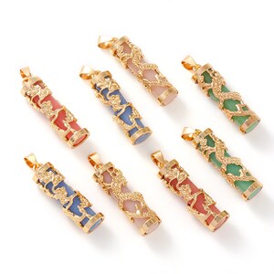 May include: Eight gold dragon pendant charms with different colored stone inserts. The stones are pink, blue, green, and a light pink. The dragon designs are intricate and detailed.