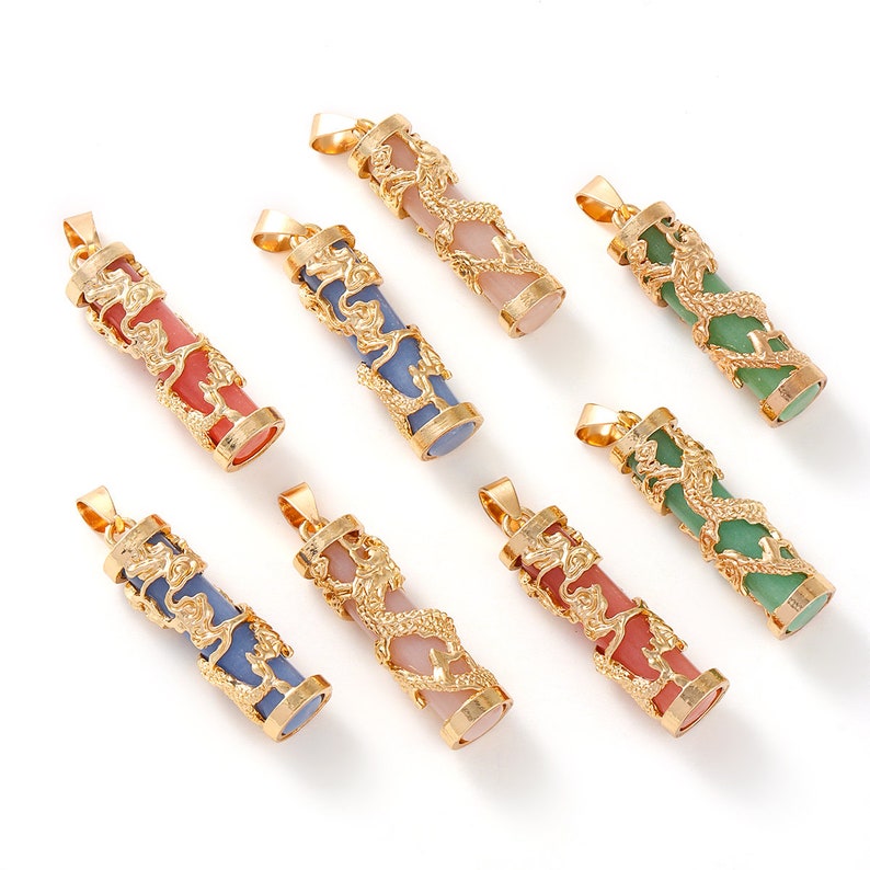 May include: Eight gold dragon pendant charms with different colored stone inserts. The stones are pink, blue, green, and a light pink. The dragon designs are intricate and detailed.