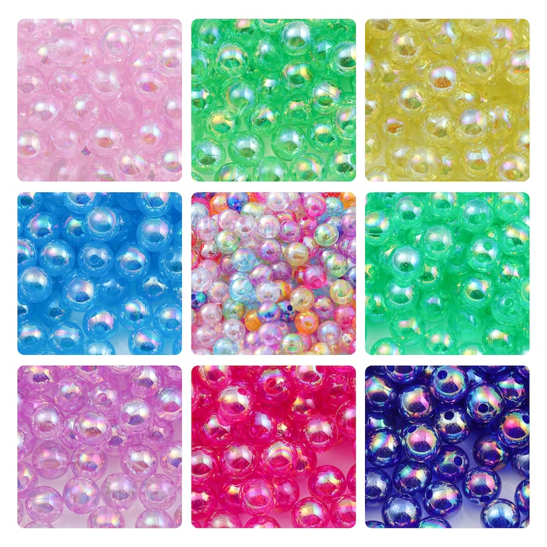 May include: Assortment of iridescent plastic beads in various colors, including pink, blue, green, yellow, and purple. The beads are round and have a smooth, glossy finish.