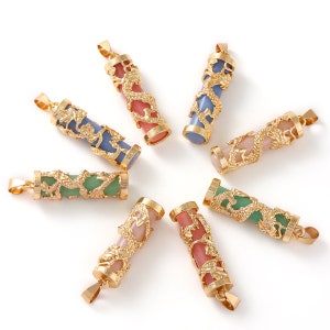 May include: Eight gold dragon pendant charms with different colored stones. The charms are in the shape of a cylinder with a dragon design. The stones are pink, green, and blue.