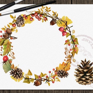 May include: A watercolor wreath with autumn leaves, pine cones, berries, and acorns. The wreath is on a white background.