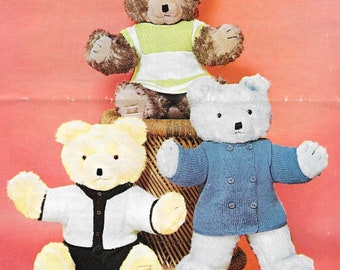 May include: Three teddy bears wearing knitted clothing. The brown bear is wearing a green and white striped dress. The white bear is wearing a blue cardigan. The yellow bear is wearing a white cardigan with black trim and black pants.