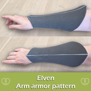 Puede incluir: Un protector de antebrazo gris oscuro con forma curva y cónica, con líneas de costura visibles a lo largo del centro. El artículo se muestra en un antebrazo y el texto "Elven Arm armor pattern" aparece en blanco en la parte inferior.