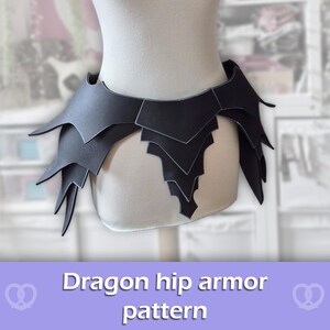 May include: A black hip armour piece featuring a layered, pointed scale design that wraps around the waist. The armour is constructed from multiple overlapping segments with defined edges, creating a sharp, angular silhouette across the hips.